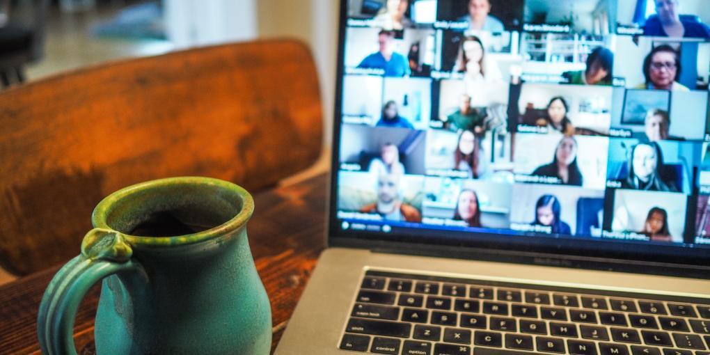 Photo of zoom meeting squares and green coffee mug